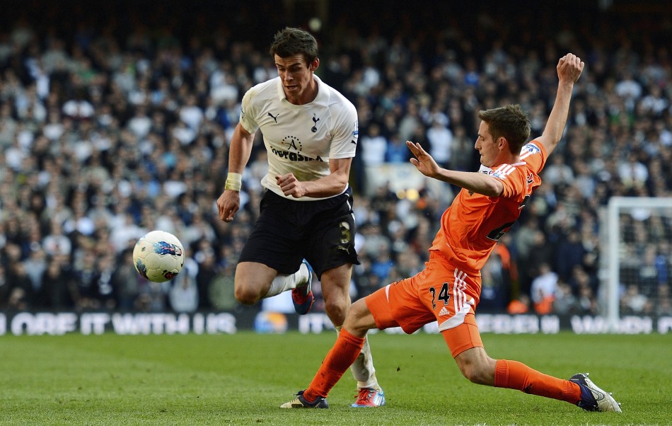 Tottenham Hotspur039s Bale challenges Swansea City039s Allen during their English Premier League soccer match in London