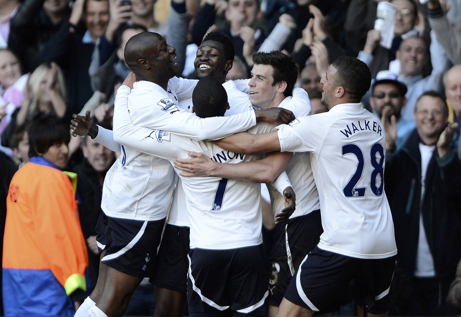 Tottenham Hotspur039s Emmanuel Adebayor is mobbed by team mates as he celebrates his second goal against Swansea