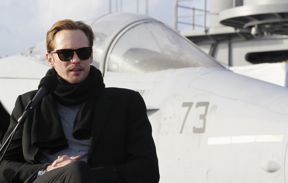 Actor Skarsgard speaks in front of a U.S. Navy FA-18 Hornet during a news conference to promote quotBattleshipquot at Yokosuka port, south of Tokyo