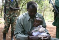 LRA leader Joseph Kony poses with son