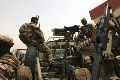 Malian soldiers stand guard at international airport in Bamako