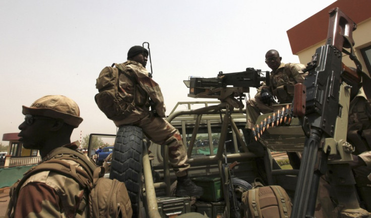 Malian soldiers stand guard at international airport in Bamako