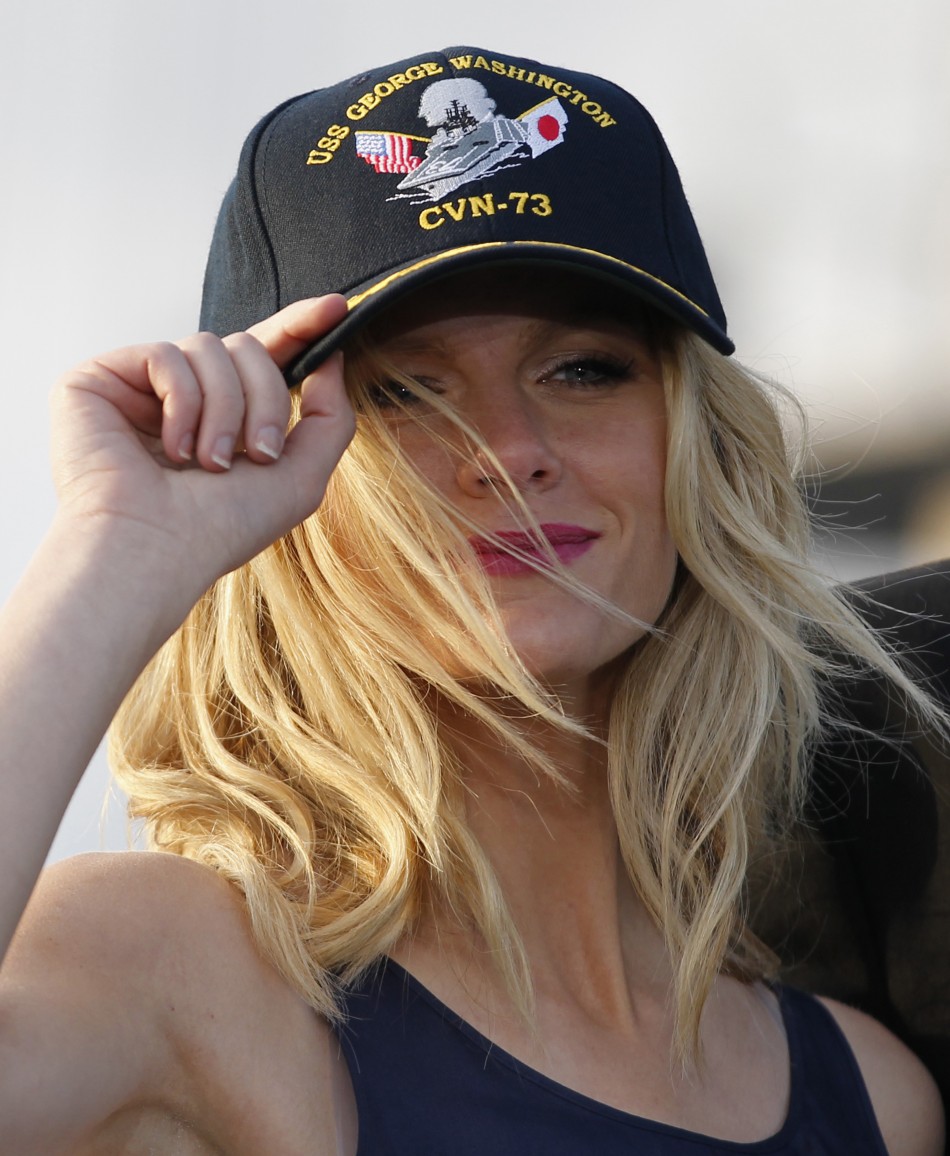 U.S. model Decker wears a cap during news conference to promote quotBattleshipquot at Yokosuka port, south of Tokyo