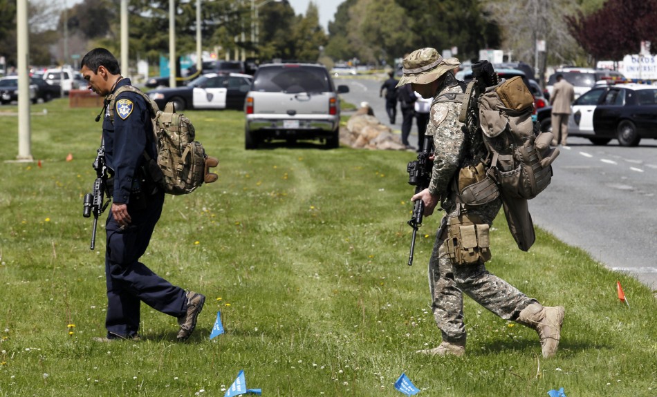 Officers leave the scene of a multiple shooting at a private Christian college in Oakland