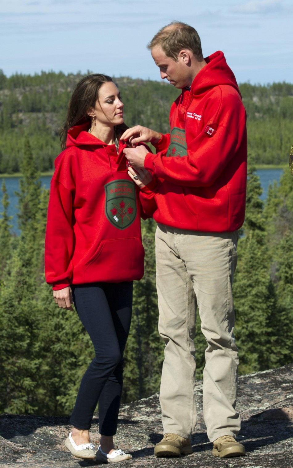 Britains Prince William and his wife Catherine, Duchess of Cambridge, wear sweaters of the Canadian Rangers during a visit to Blatchford Lake, Northwest Territories
