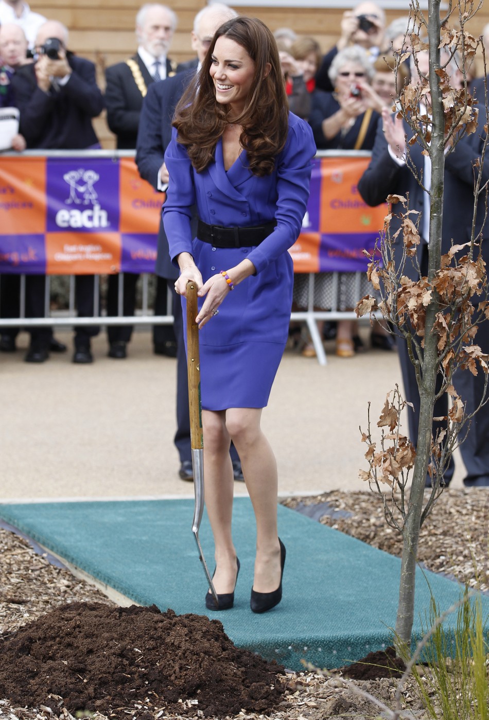 Britains Catherine, Duchess of Cambridge plants a tree after opening a childrens hospice in Ipswich