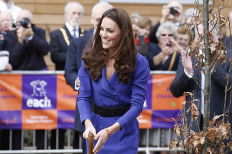 Britain's Catherine, Duchess of Cambridge plants a tree after opening a children's hospice in Ipswich