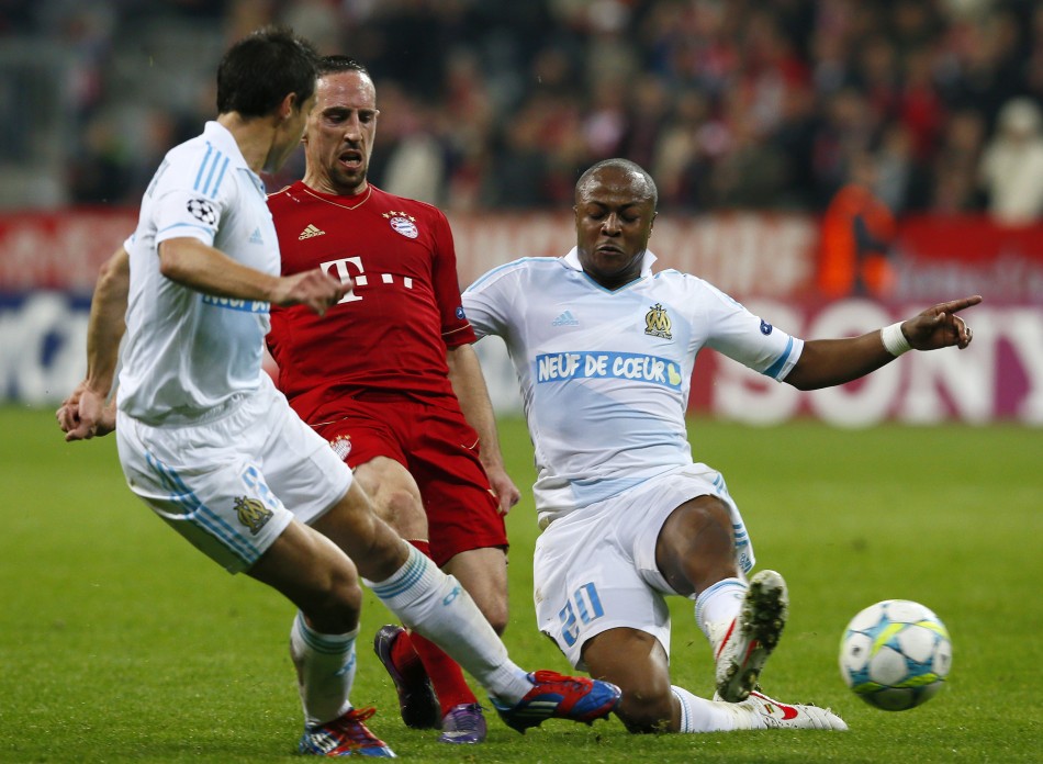 Franck Ribery , French midfielder of Bayern Munich outplays Azpilicueta and Andre Ayew of Olympique Marseille during their Champions League quarter-final second leg soccer match in Munich