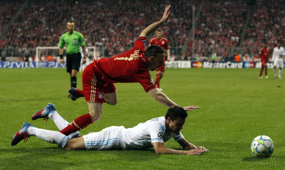 Bayern Munich039s Ribery falls over Olympique Marseille039s Azpilicueta during Champions League quarter-final soccer match in Munich