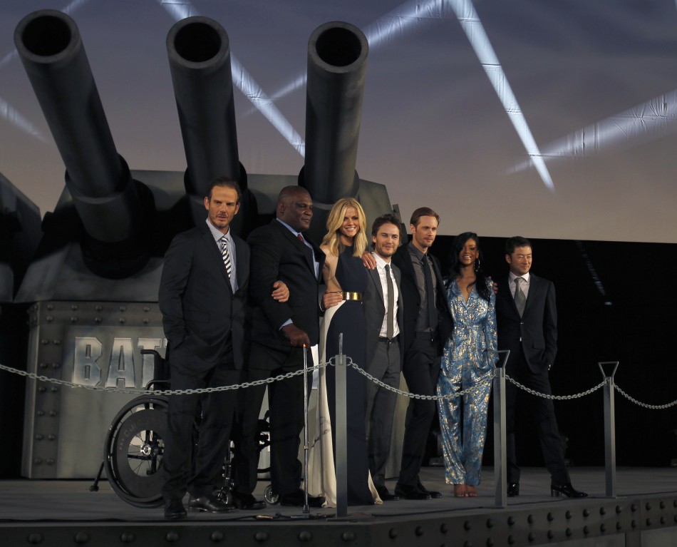 Director Berg poses with cast members of his film quotBattleshipquot at the films world premiere in Tokyo