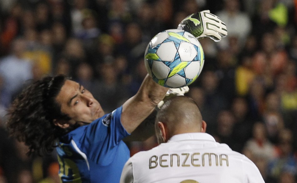 APOEL039s goalkeeper Chiotis saves the ball from a header of Real Madrid039s Benzema during their Champions League quarter-final first leg soccer match in Nicosia