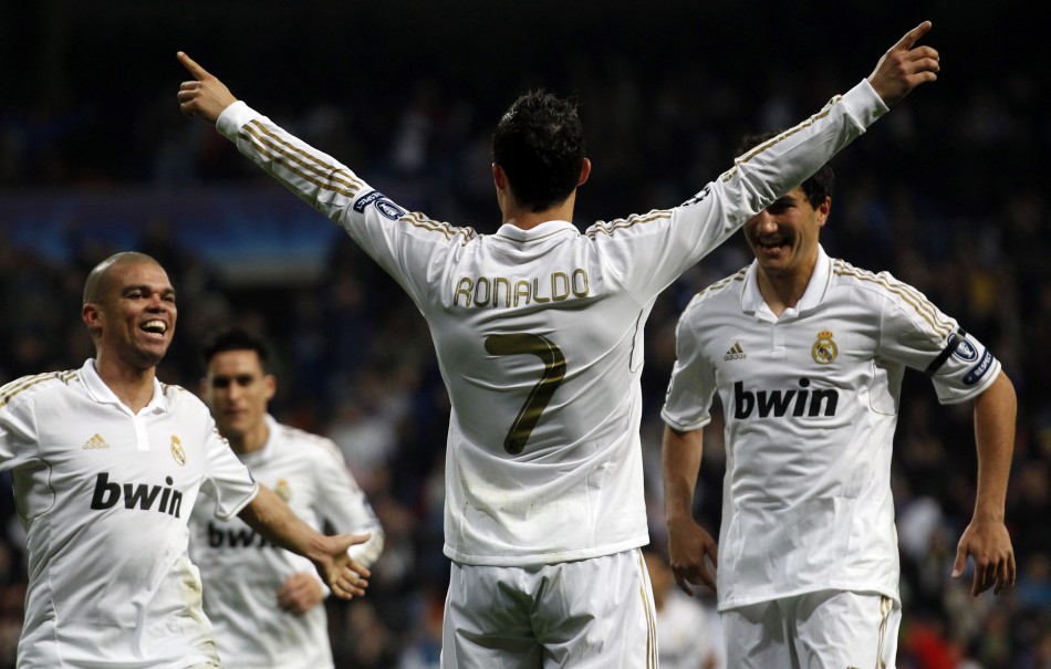 Real Madrid039s Ronaldo celebrates a goal with Pepe and Sahin after scoring against APOEL during their Champions League quarter-final second leg soccer match in Madrid