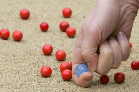 A participant competes at the World Marbles Championships near Crawley in West Sussex