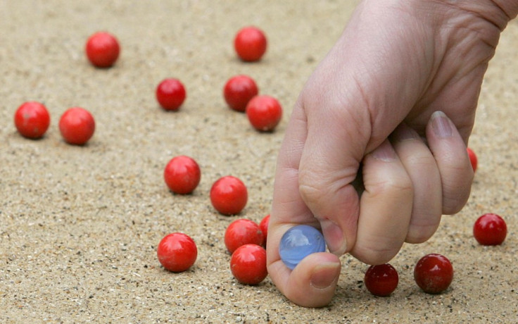 A participant competes at the World Marbles Championships near Crawley in West Sussex