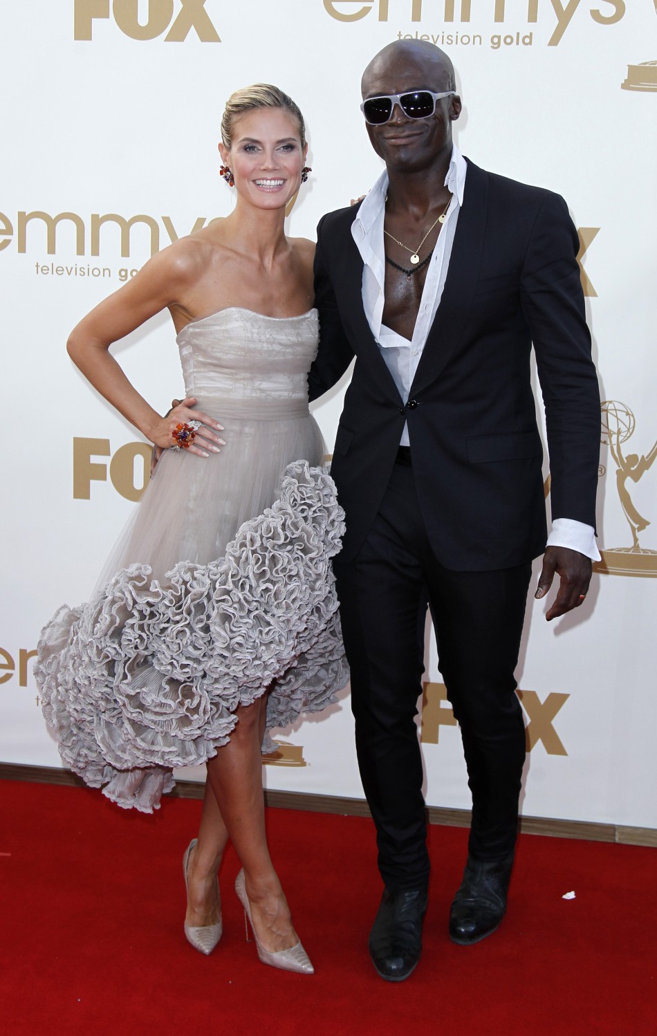 Television host Heidi Klum and her husband, singer Seal, arrive at the 63rd Primetime Emmy Awards in Los Angeles