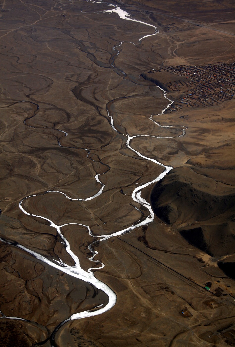 A frozen river is seen located on the outskirts of the Mongolian capital city of Ulan Bator