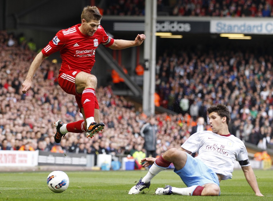 Aston Villa039s Lichaj challenges Liverpool039s Gerrard during their English Premier League soccer match in Liverpool
