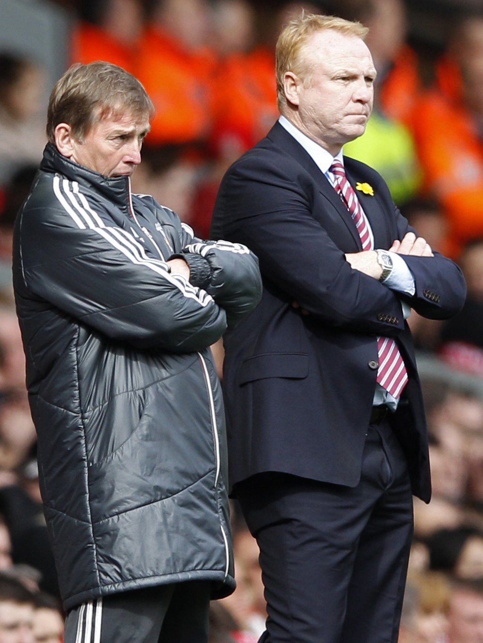 Liverpool039s manager Dalglish and his Aston Villa counterpart McLeish watch their teams during their English Premier League soccer match in Liverpool