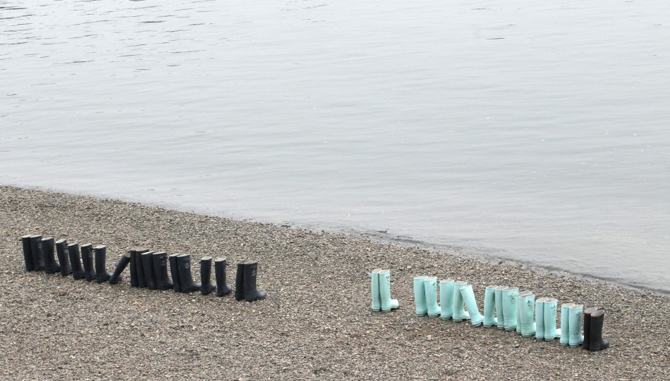 Wellington boots await the arrival of the Oxford and Cambridge rowing teams in the 157th Boat Race in London