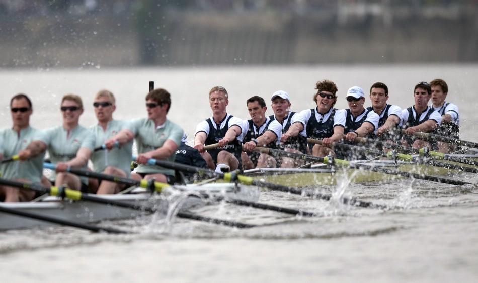 The Oxford rowing team pull past the Cambridge team during the 157th Boat Race on the River Thames in London