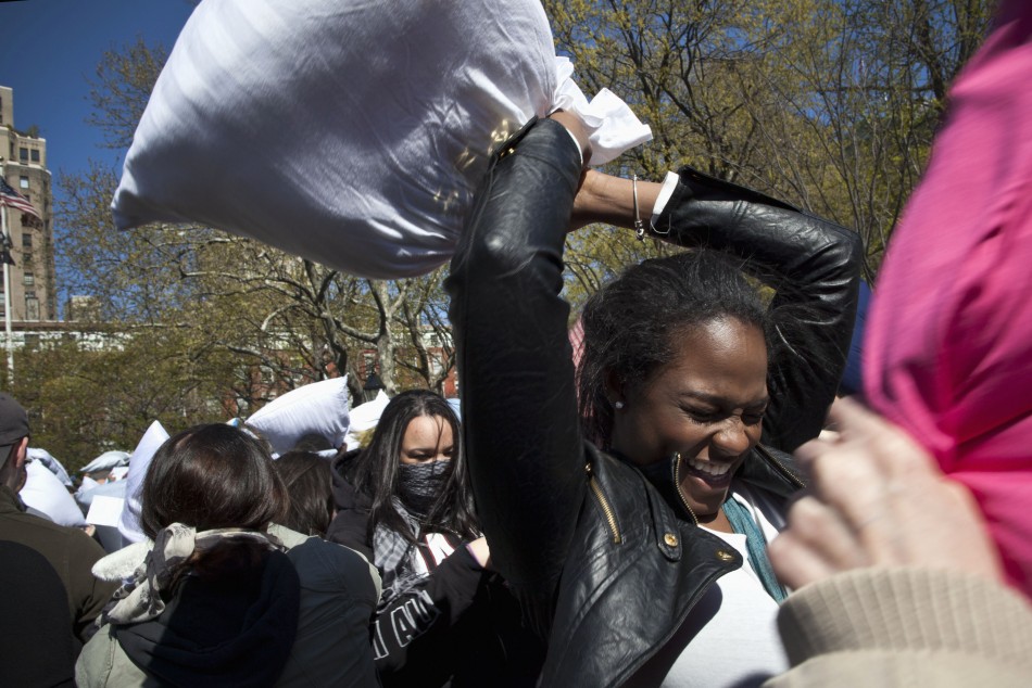People participate in International Pillow Fight Day in Washington Square Park in New York