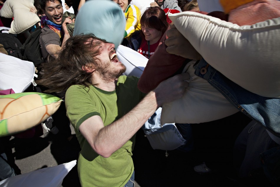People participate in International Pillow Fight Day at Washington Square Park, in New York
