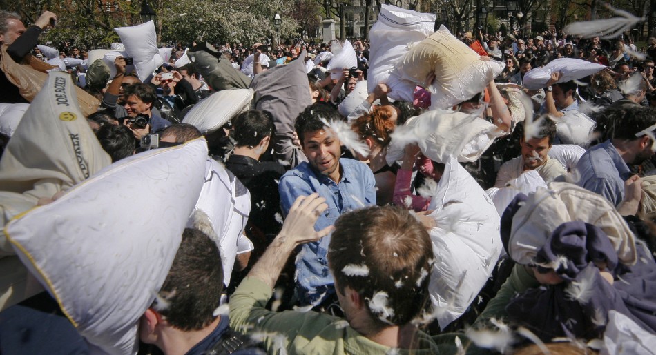 Hundreds participate in a mass pillow fight as part of the International Pillow Fight Day in New Yorks Washington Square Park
