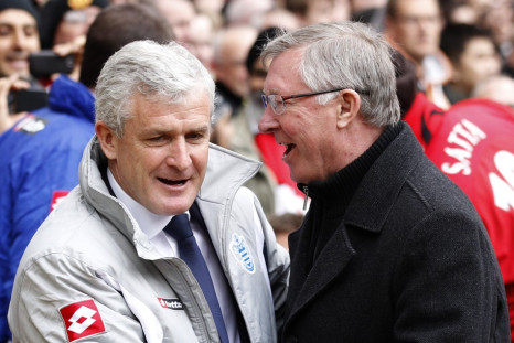 Manchester United&#039;s manager Ferguson greets his Queens Park Rangers counterpart Hughes during their English Premier League soccer match in Manchester
