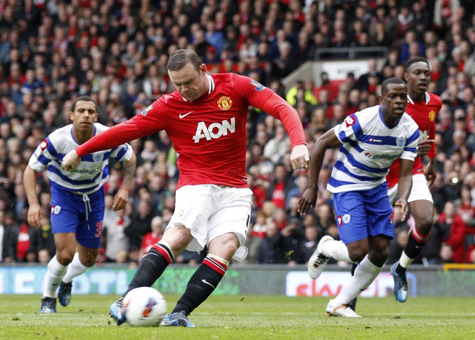 Manchester United039s Rooney scores a penalty against Queens Park Rangers during their English Premier League soccer match in Manchester