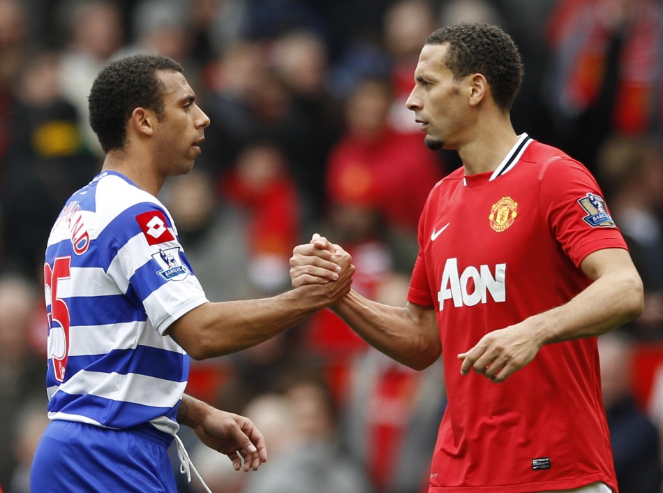 Manchester United039s Ferdinand shakes hands with Queens Park Rangers039 Ferdinand after their English Premier League soccer match in Manchester