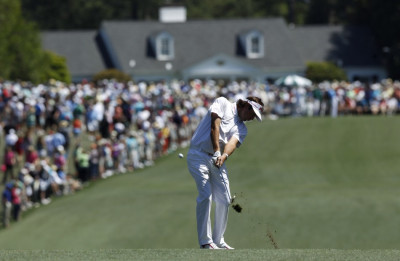 Watson of the U.S. chips to the first green during third round play in the 2012 Masters Golf Tournament in Augusta Watson of the U.S. chips to the first green during third round play in the 2012 Masters Golf Tournament in Augusta