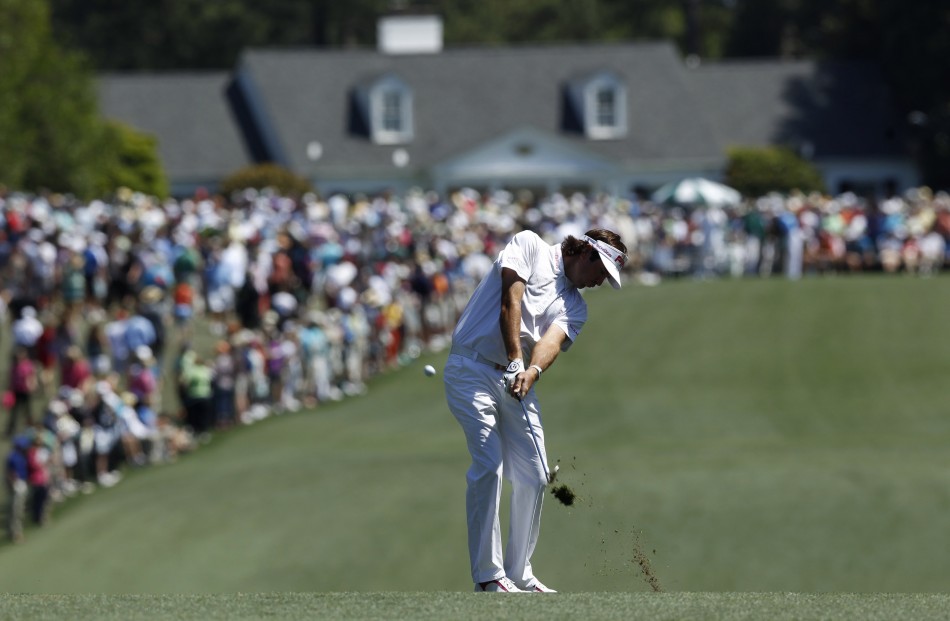 Watson of the U.S. chips to the first green during third round play in the 2012 Masters Golf Tournament in Augusta