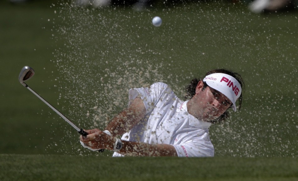 Watson of the U.S. hits from a sand trap on the second hole during final round play in the 2012 Masters Golf Tournament in Augusta
