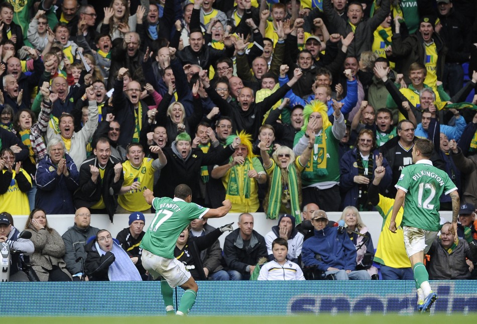 Norwich City039s Elliott Bennett celebrates with Norwich City fans after scoring against Tottenham Hotspur during their English Premier League soccer match at White Hart Lane in London