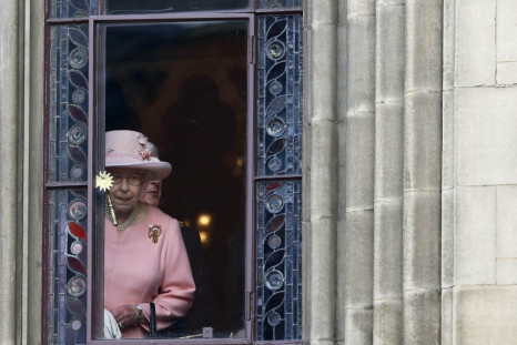 Britain&#039;s Queen Elizabeth looks out of a window during her visit to Manchester town hall in northern England