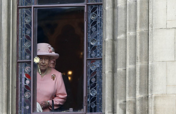 Britain&#039;s Queen Elizabeth looks out of a window during her visit to Manchester town hall in northern England