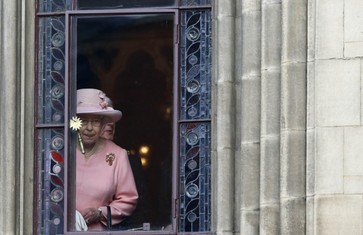 Britain's Queen Elizabeth looks out of a window during her visit to Manchester town hall in northern England