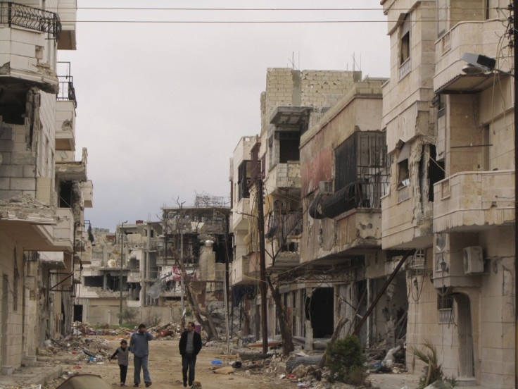 Houses damaged by the government army, according to the opposition, are seen in the Inshaat district of Homs