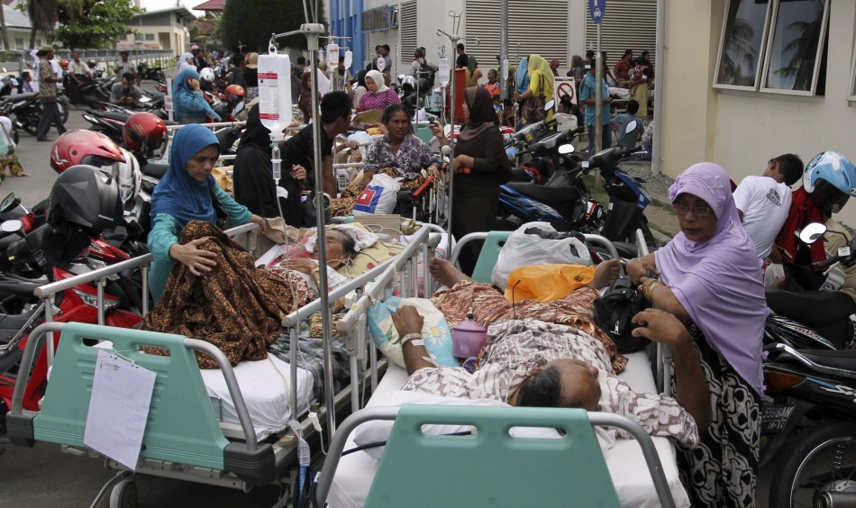 Patients are evacuated from a hospital after an earthquake hit the western coast of Sumatra, in Banda Aceh in Aceh province