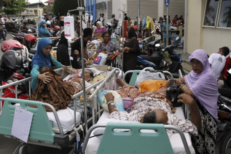Patients are evacuated from a hospital after an earthquake hit the western coast of Sumatra, in Banda Aceh in Aceh province
