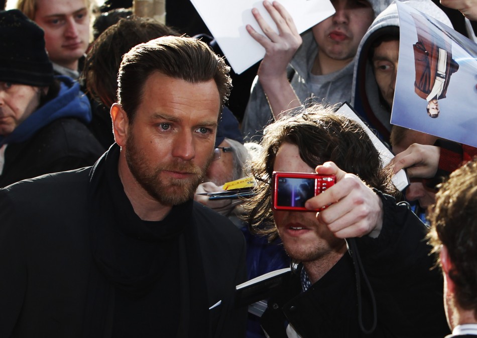 Actor Ewan McGregor has a photograph taken with a fan as he arrives for the European premiere of quotSalmon Fishing in the Yemenquot at the Odeon Kensington in London