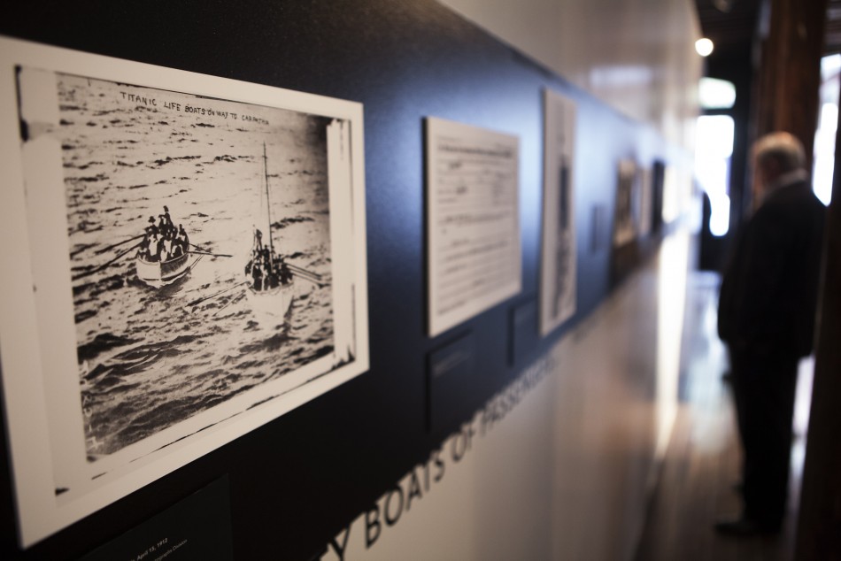 A photograph of lifeboats containing survivors from the sinking of the Titanic hang on the wall at an exhibit in the South Street Seaport Museum commemorating the 100th anniversary of the sinking of the Titanic in New York