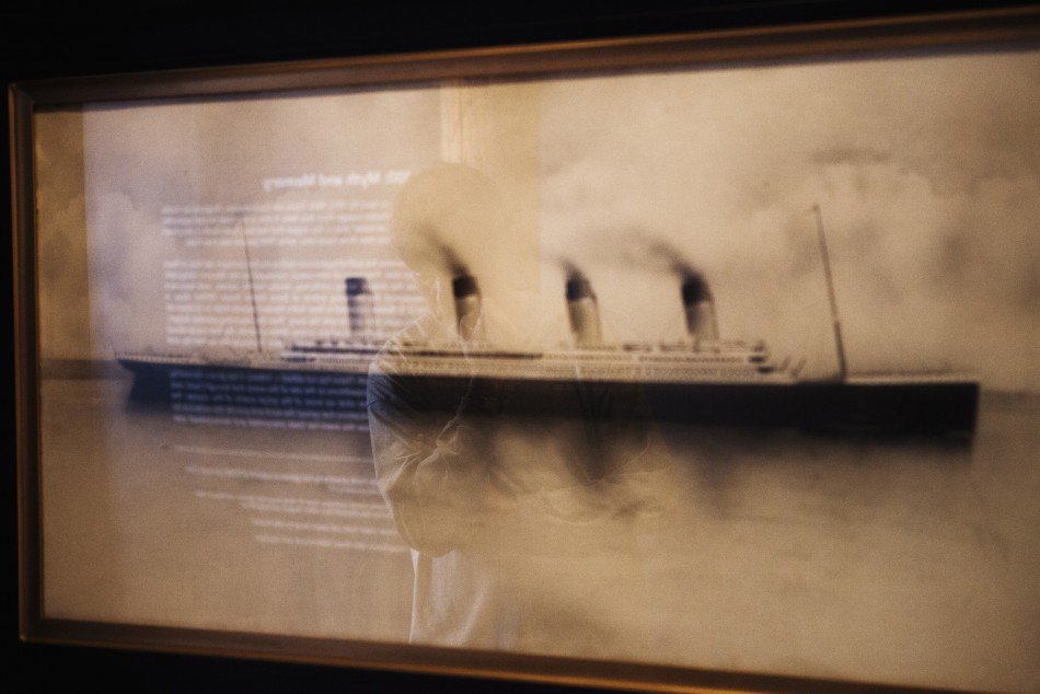 A patron stops to look at a drawing of the Titanic on the wall of an exhibit in the South Street Seaport Museum commemorating the 100th anniversary of the sinking of the Titanic in New York