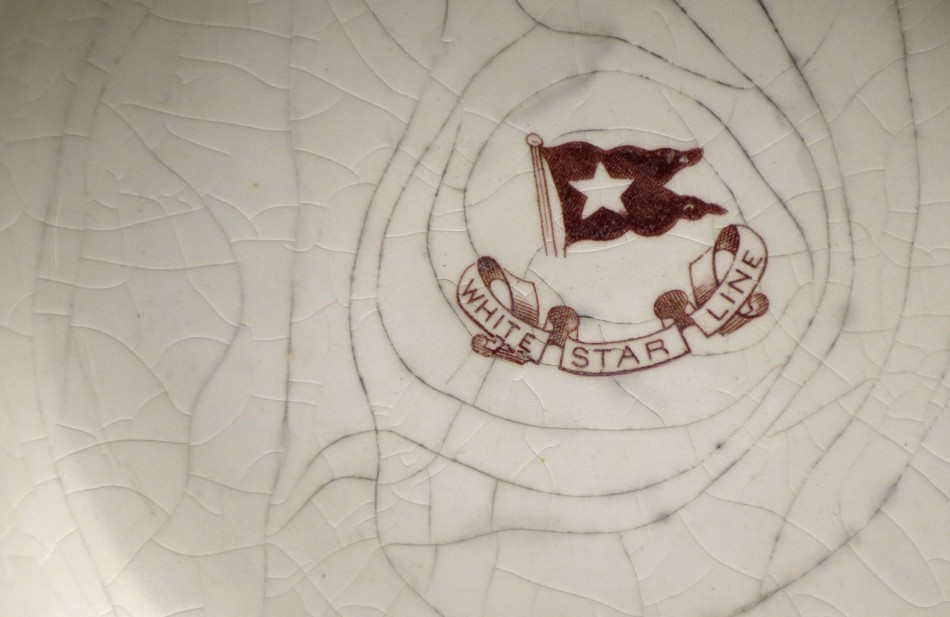 The White Star Line logo is seen on a bowl recovered from the wreck site of Titanic at the opening of a new exhibition at the Merseyside Maritime Museum