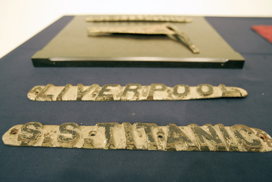 Cast bronze name board from Titanic cruise ships life boat sits on display at Christies in New York
