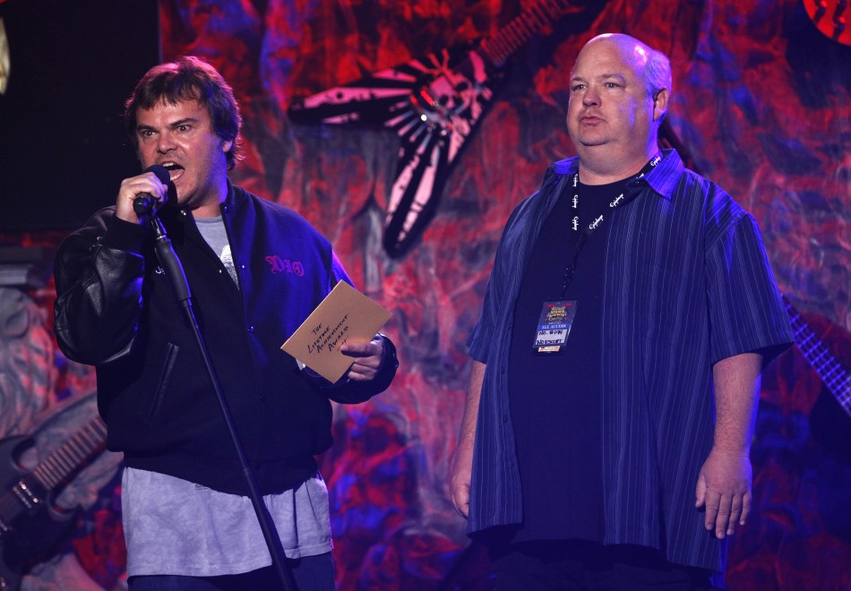 Members of American rock band Tenacious D Jack Black L and Kyle Gass speak on stage at the fourth annual Golden Gods awards at Nokia theatre in Los Angeles