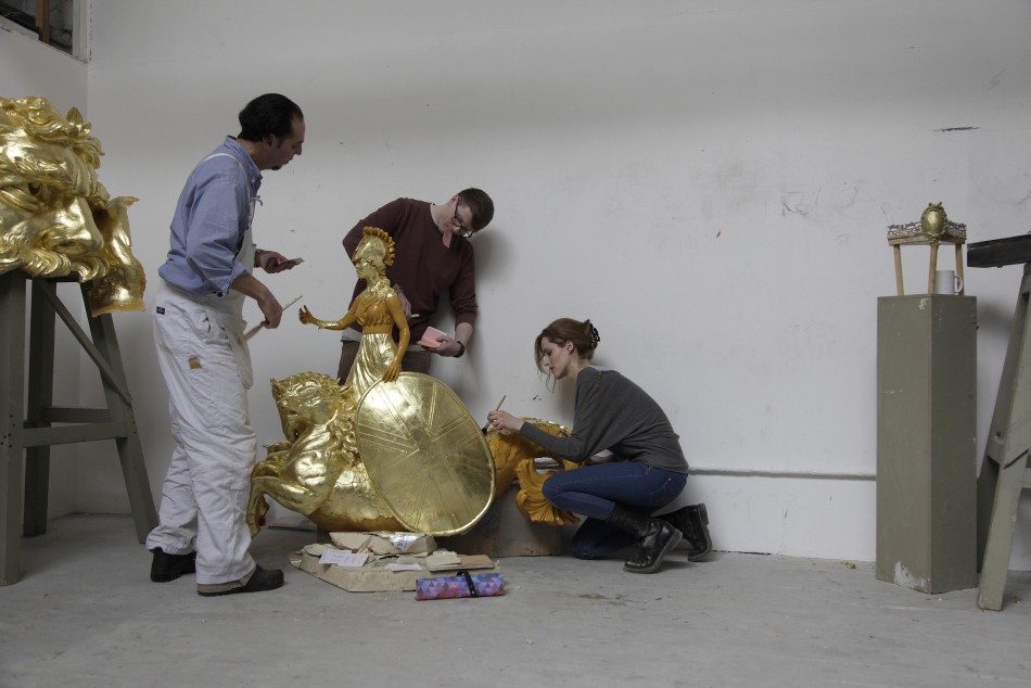 City and Guilds students work on one of the decoration for the Diamond Jubilee Pageant Royal Barge at the London Art School in London