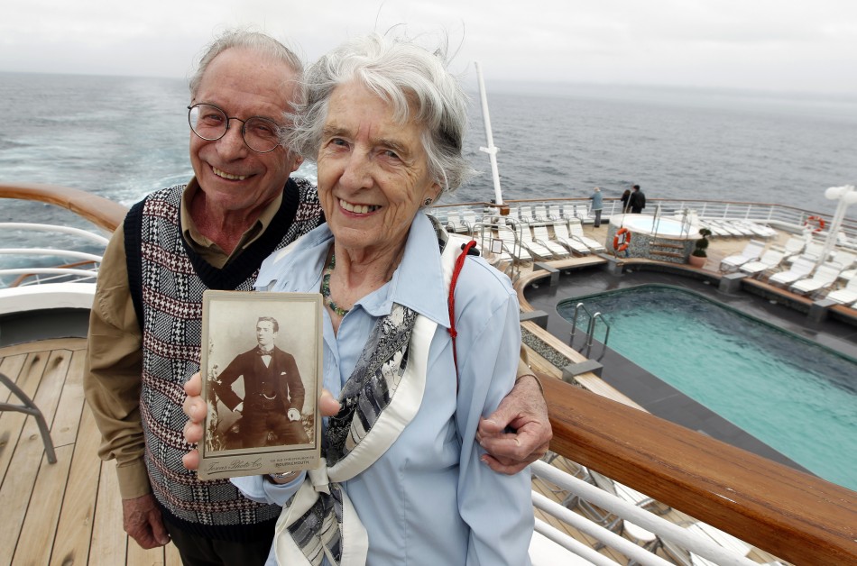 Patricia Watt holds a picture of her grandfather George Mackie while onboard the Titanic Memorial Cruise in the mid-Atlantic Ocean