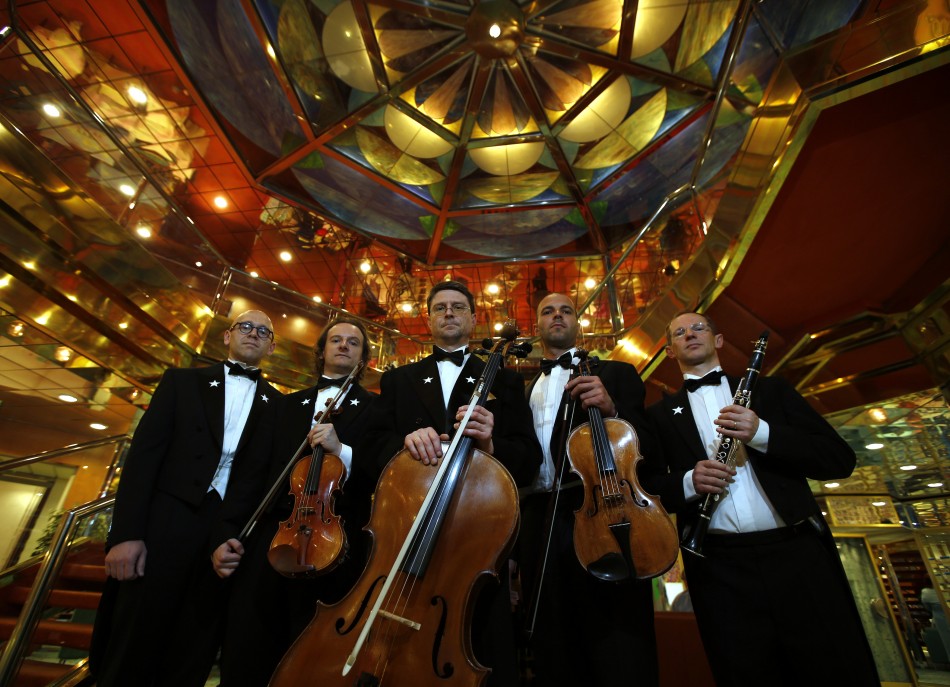 Members of the Belgian quintet ensemble Grupetto pose onboard the Titanic Memorial Cruise in the mid-Altantic Ocean