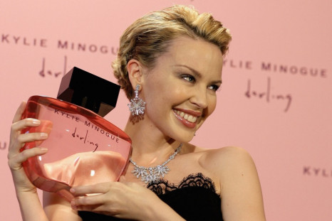 Pop star Minogue poses with her new perfume &quot;Darling&quot; in London